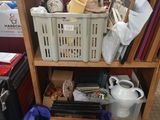 a wooden shelf with baskets and other items on it