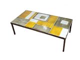 a coffee table with a yellow and white design on it