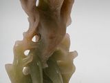 a close up of a vase with a flower inside of it
