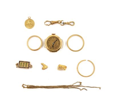 an image of a collection of gold jewelry including a watch, bracelet, ring, and other items