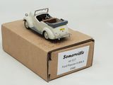 a small toy car sitting on top of a cardboard box