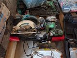 a pile of tools sitting on the floor in a room