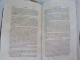 an open book that is sitting on a table