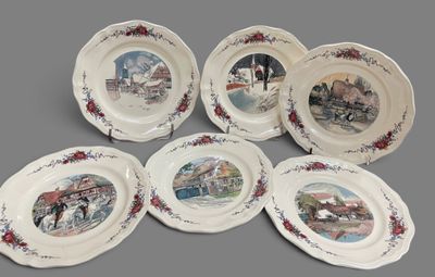 six plates with a picture of a train on them on a gray surface
