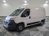 the white van is parked on a checkered floor in a room