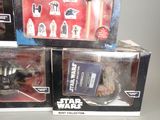 two star wars action figures on display in the box