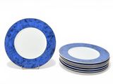 several blue and white plates are stacked on top of each other
