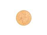 a close up of a gold coin on a white background