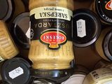 many jars of food that are sitting on a table