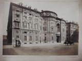 an old picture of a building with a horse and buggy in front of it
