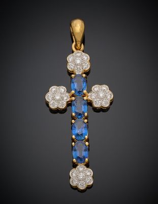 un pendentif en forme de croix, orné de saphirs et de diamants