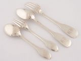four silver spoons and a fork on a white surface