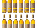 a group of bottles of wine sitting on top of a white surface