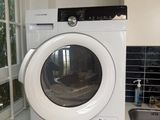 a white washer and dryer in a small kitchen