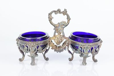 pair of silver and blue glass vases on stand on white background