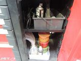 a red fire truck with a bunch of items inside of it