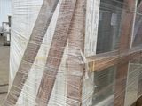 a large window that has been wrapped up on a pallet