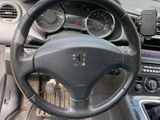 dashboard of a car with a steering wheel and dashboard gauges