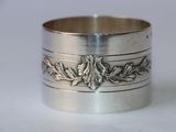 a close up of a silver ring on a white surface