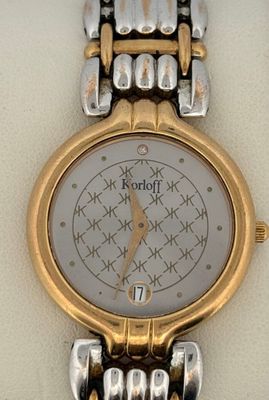 an image of a close up of a wrist watch on a white surface
