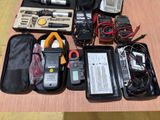 many electronic equipment in a case on a table