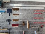 a garage with a wall of tools and tools on the wall