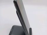 a cell phone that is sitting on top of a stand