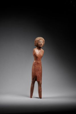 an image of a statue of a woman standing in a dark room
