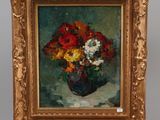a painting of flowers in a vase on a easel