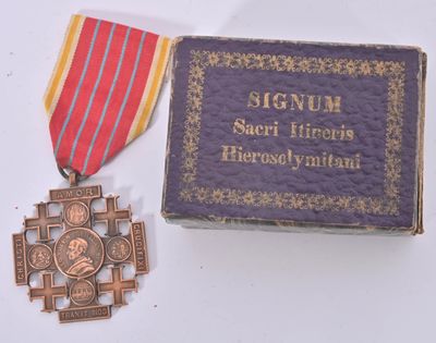 a small box with a medal and a medal on it