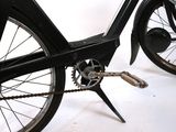 a close up of a bicycle with a chain attached to it