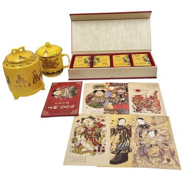 a box of cards and a teapot on the table