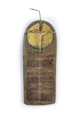 an old wooden plaque with a crucifix on it