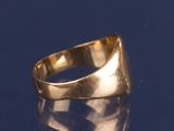 a gold ring sitting on top of a blue surface