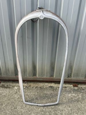 a metal frame that is leaning up against a wall