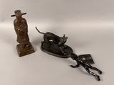 a statue of a man on a horse and a horse drawn sleigh