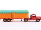 a red truck with a green roof and a red truck with a green roof
