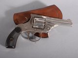 revolver with leather case on white surface with white background