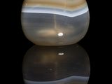 a picture of a glass vase with a black background