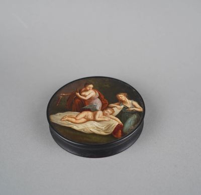 a small black box with a painting of a woman laying on a bed