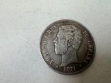 a close up of a coin on a table with a white background