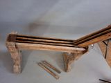a wooden bench that is made out of wood planks