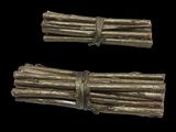 two bundles of sticks tied together on a black background