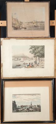 three framed pictures of boats on display in a room