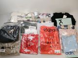 a lot of t - shirts that are sitting on a table