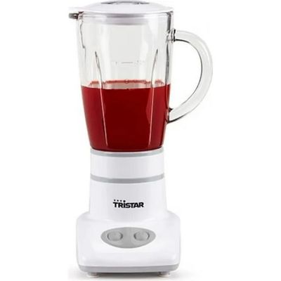 a blender that has a red liquid in it