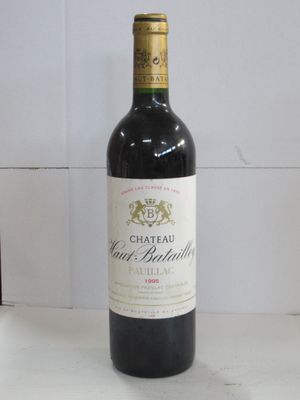 a bottle of wine that is sitting on a table