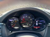 a close up of a car dashboard with various gauges