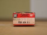 a box of cigarettes sitting on a table next to a wall