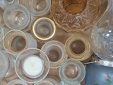 a box full of empty glassware and a bottle